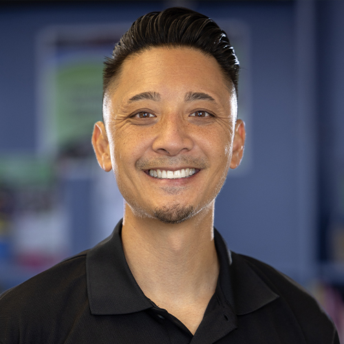 Nelson Chen wearing a black polo