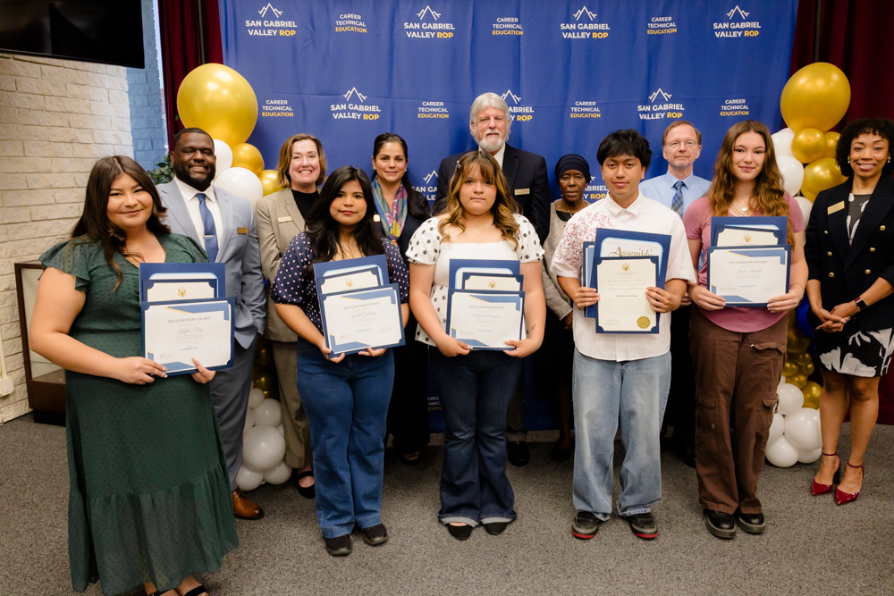 Students who received scholarships posing with SGVROP Board Members and Management